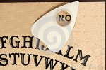 ouija-board-planchette-pointing-to-no-29095111.jpg